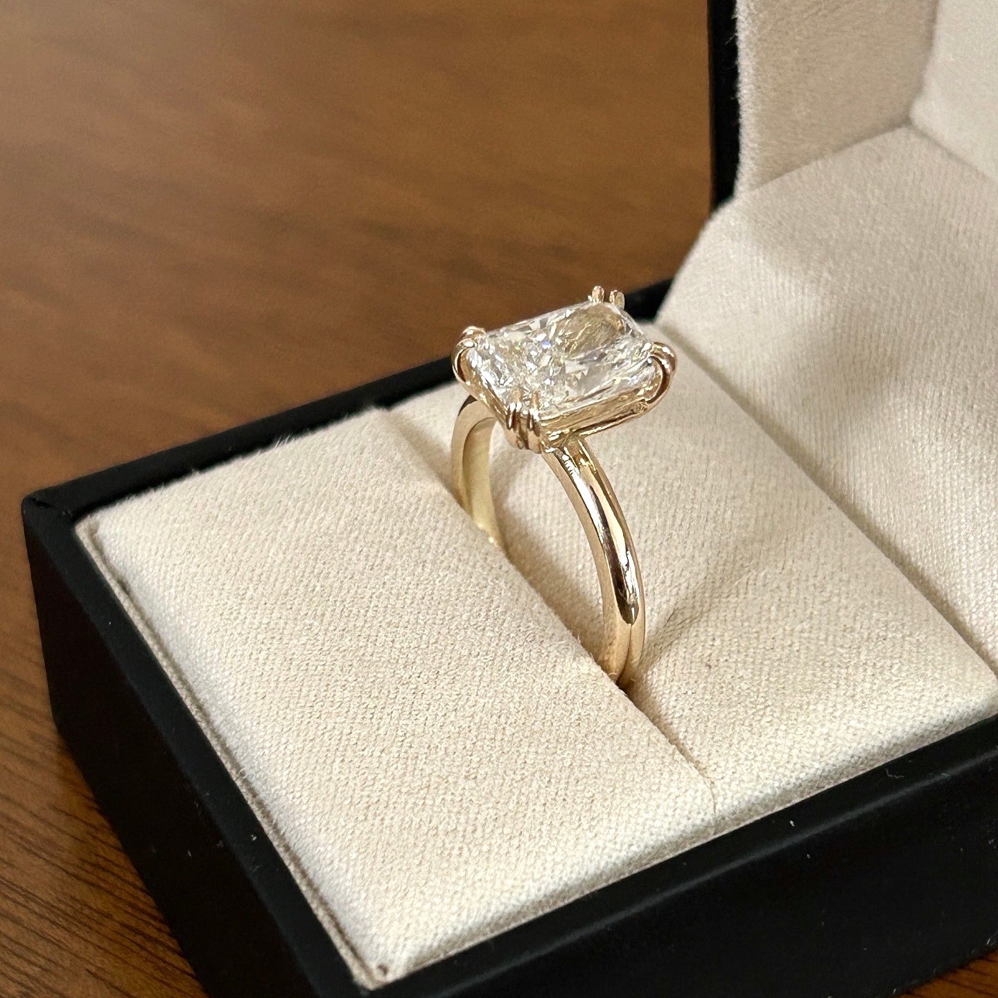 Double prong radiant cut diamond solitaire ring.