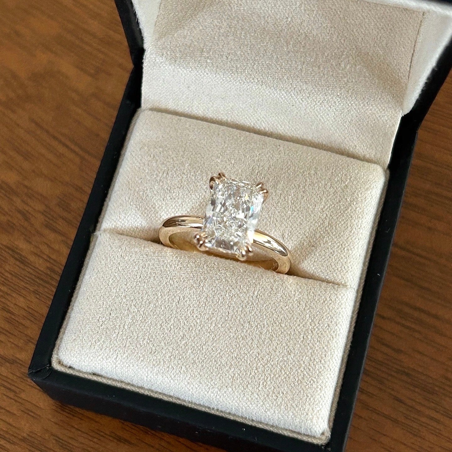 Double prong radiant cut diamond solitaire ring.