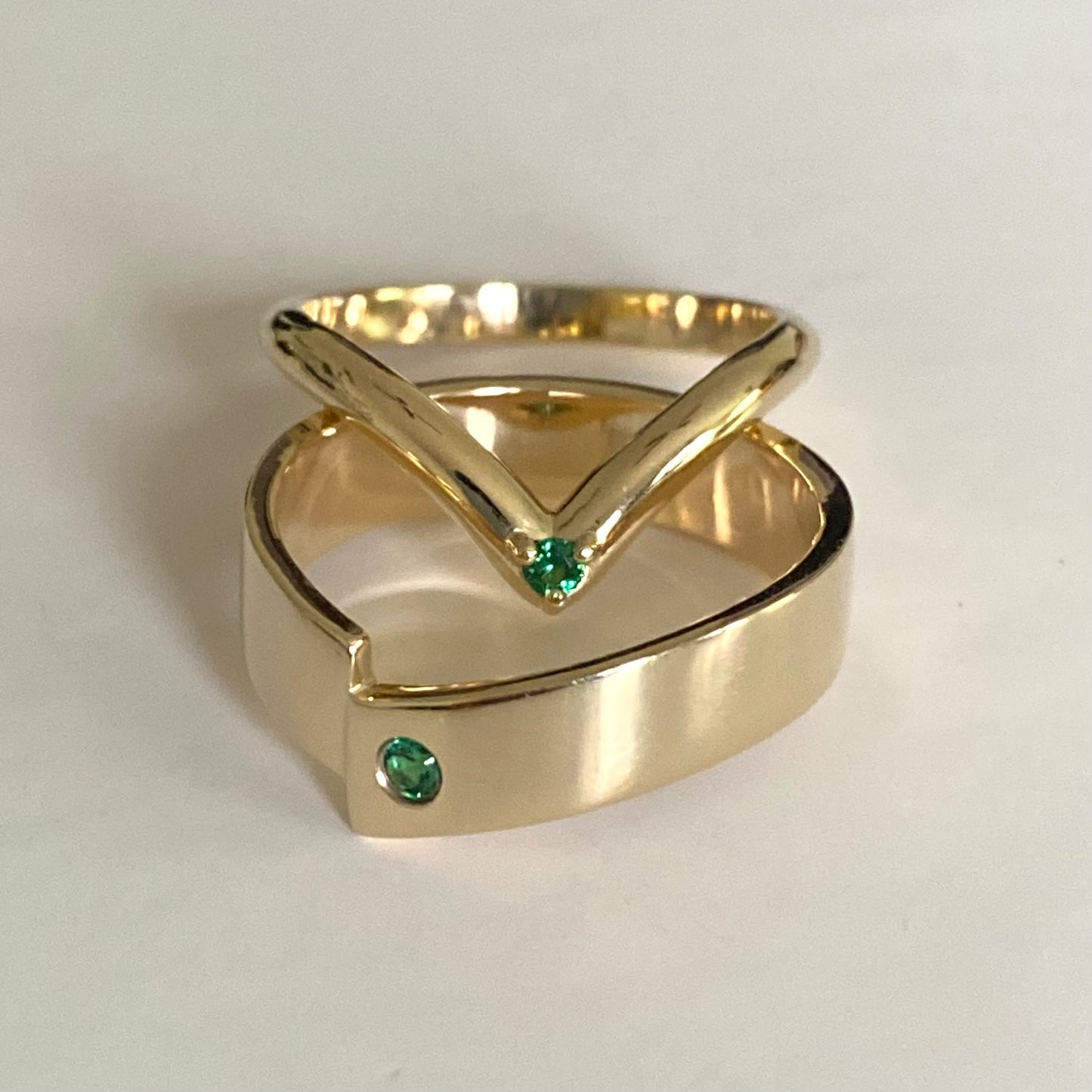 Pair of V shape wedding bands with accent stone