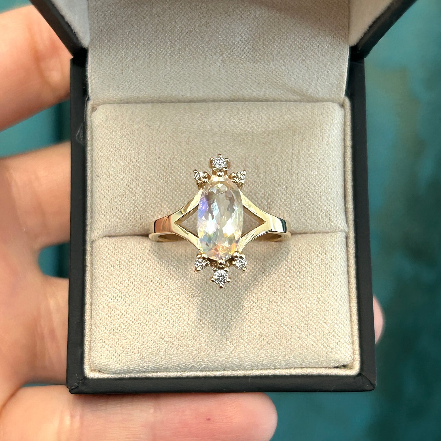 Oval cut rainbow Moonstone and diamonds burst ring in 14K yellow gold