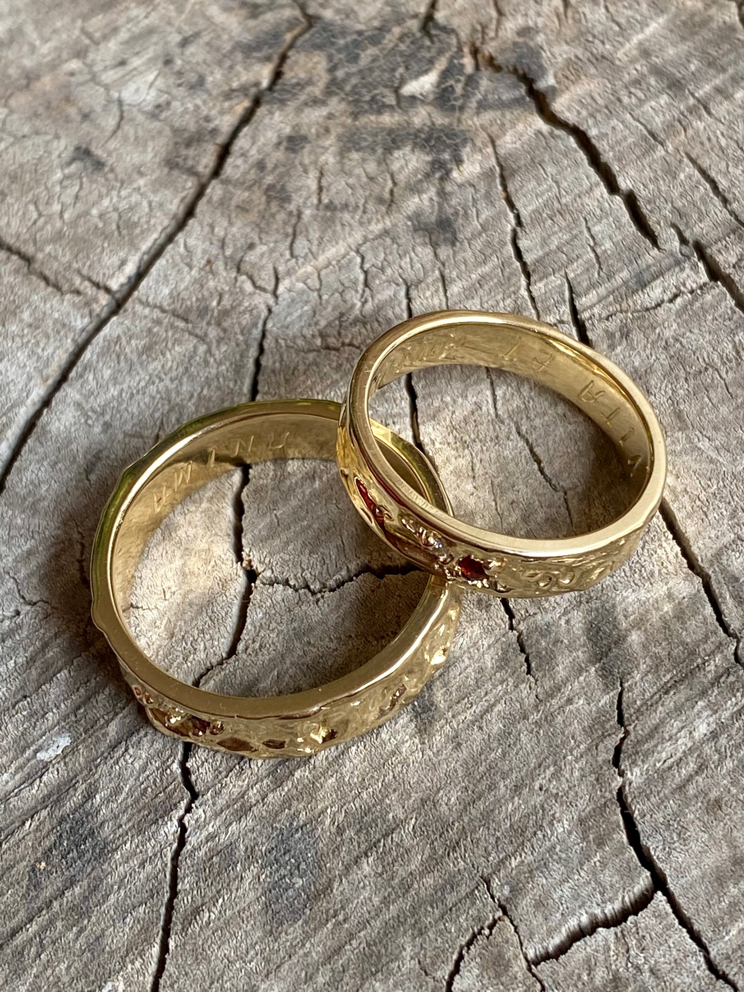 Pair of organic wedding bands with two gemstones