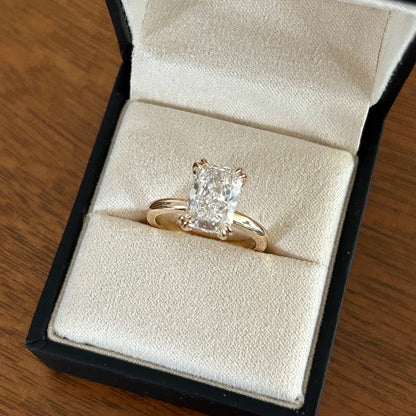 Double prong radiant cut diamond solitaire ring.