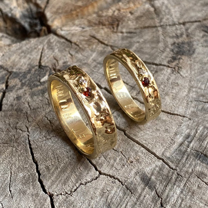 Pair of organic wedding bands with two gemstones