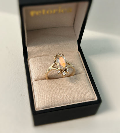 Oval cut rainbow Moonstone and diamonds burst ring in 14K yellow gold