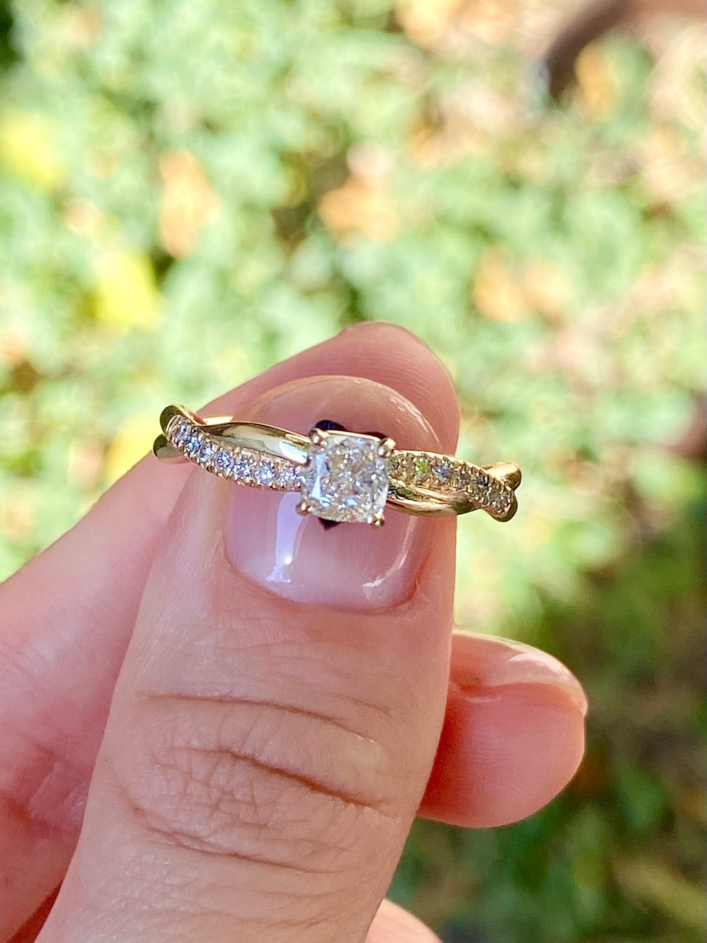 Twisted cushion cut diamond engagement ring