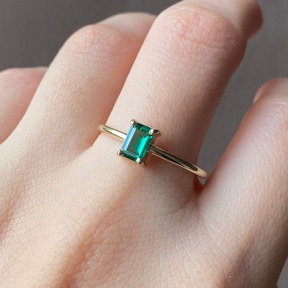 Petite emerald solitaire ring