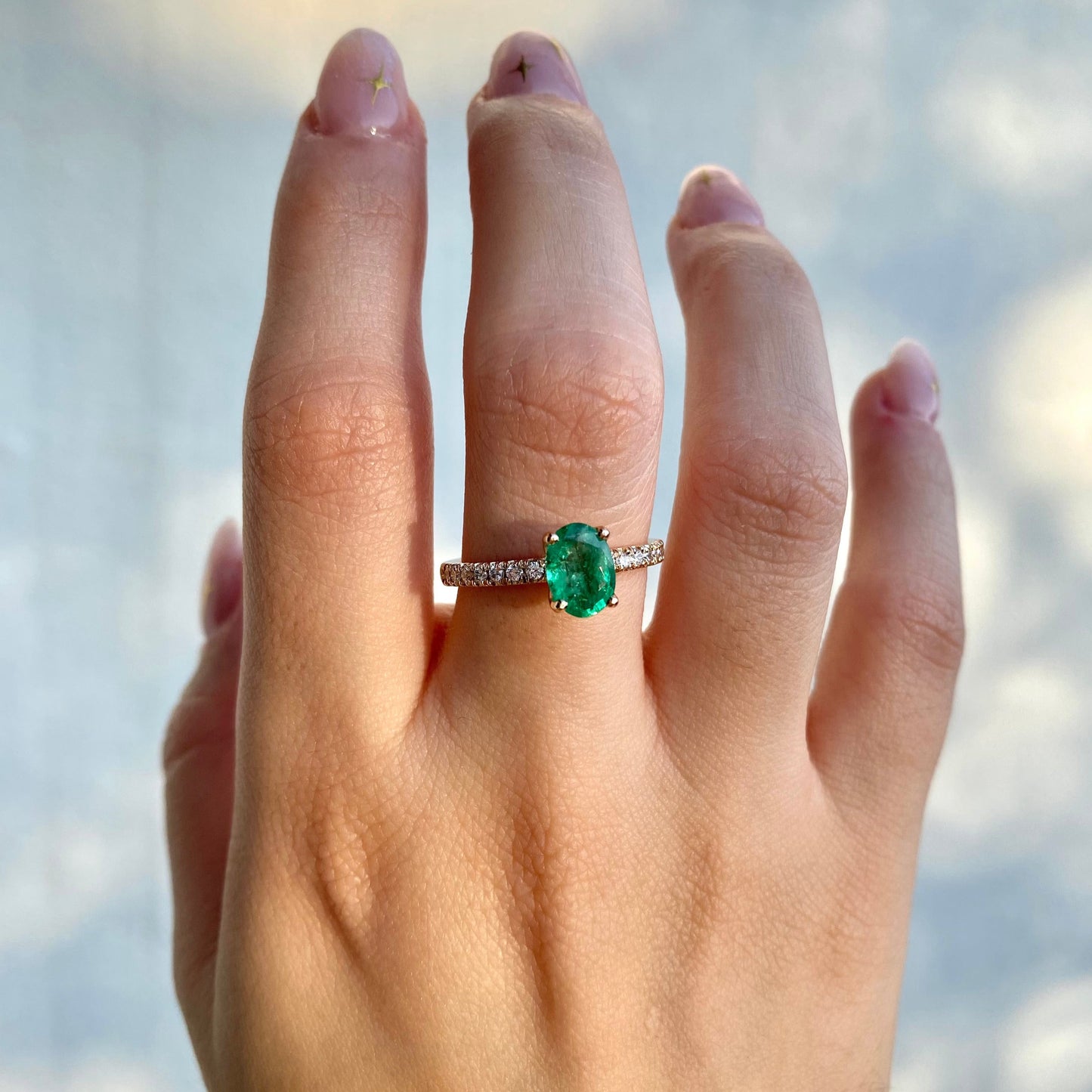 Oval cut emerald engagement ring