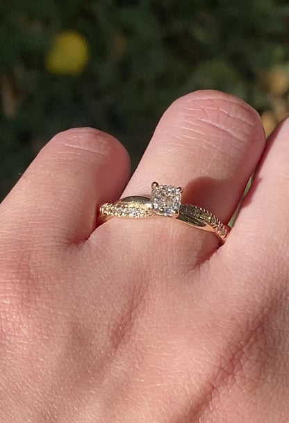 Twisted cushion cut diamond engagement ring