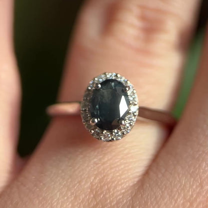 Black oval sapphire halo engagement ring