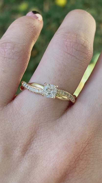 Twisted cushion cut diamond engagement ring