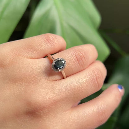 Black oval sapphire halo engagement ring