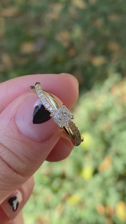 Twisted cushion cut diamond engagement ring